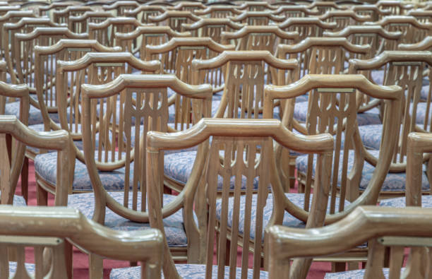 Close up of the long wooden chairs in the church
