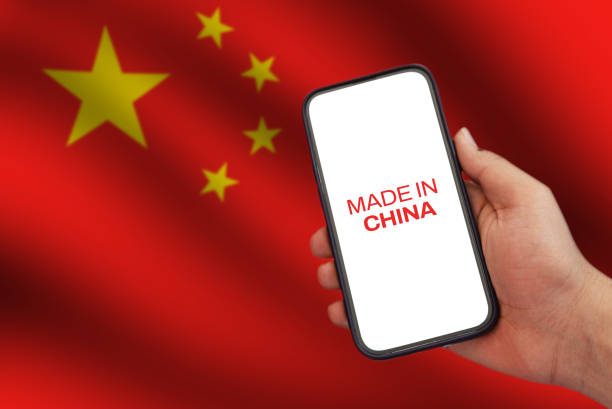 istock Smartphone manufecturing by China with waving flag and china typography on the green, tech backdrop 2157202057