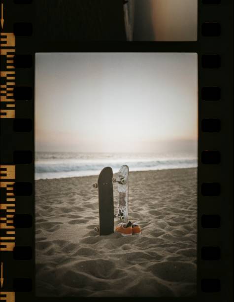 Skateboards at the beach in a film strip