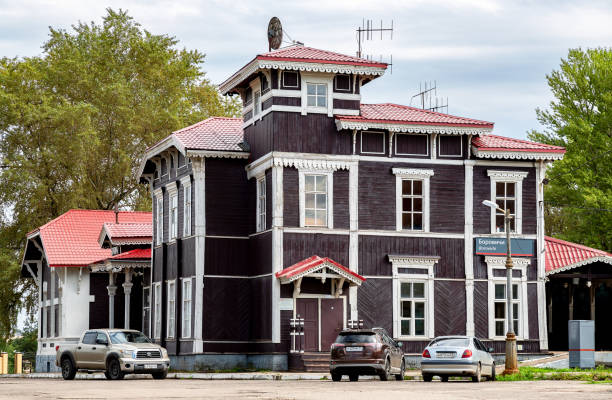 Borovichi, Russia - August 10, 2021: Old wooden provincial railway station with platform in summer day