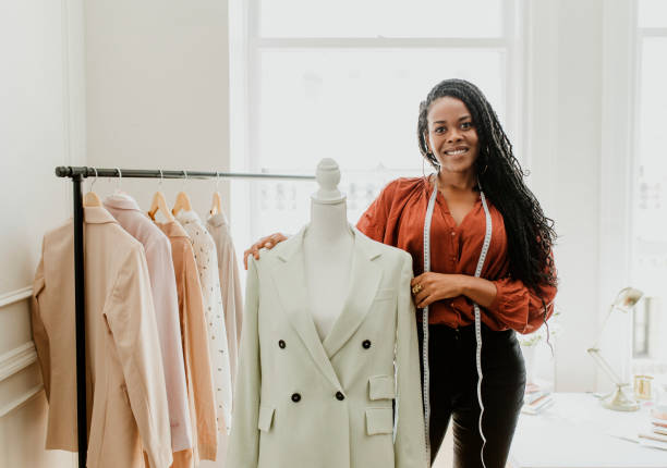 istock Black fashion stylist with a pinnable mannequin 2157206228