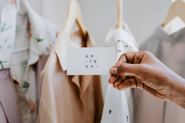 istock Hand holding business card at a boutique 2157206244