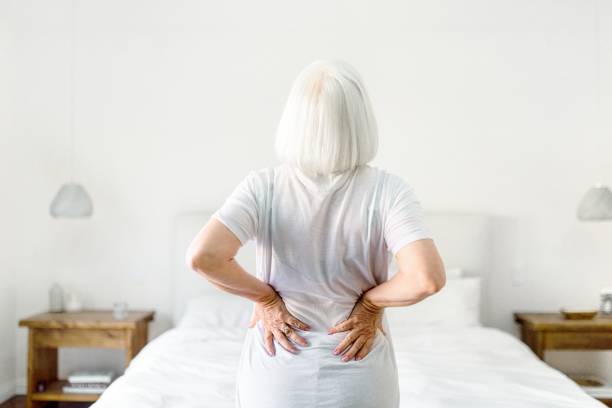 istock Senior woman suffering from back pain, health issue concept image 2157206828