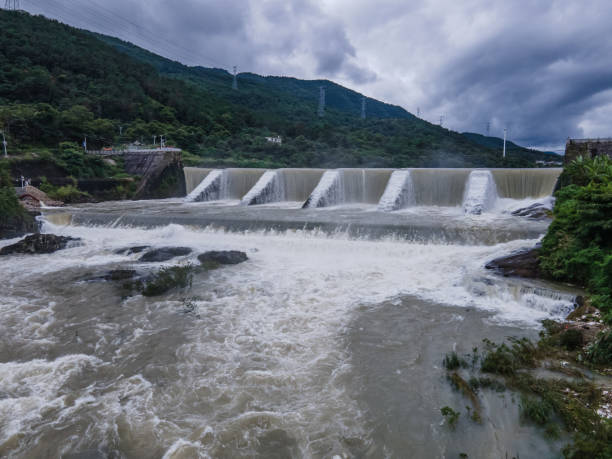 istock Waterfalls and river formed by the lake overflowing the dam 2157207497