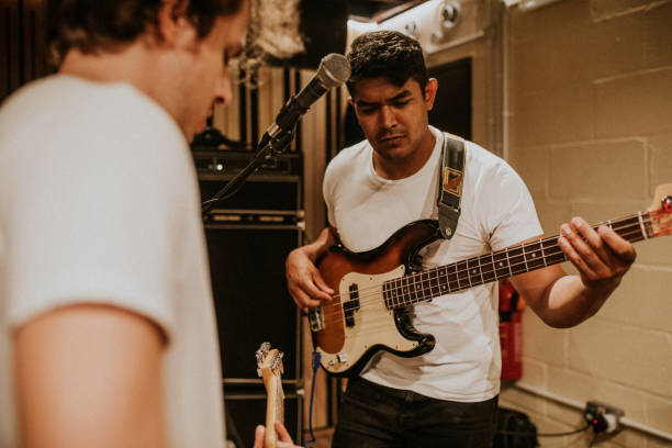 istock Music band guitarist performing repetition in recording studio 2157207613
