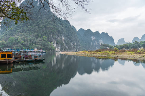 istock Old Bamboo rafts at the Li river shore in Xingping, Guilin, China. 2157208427