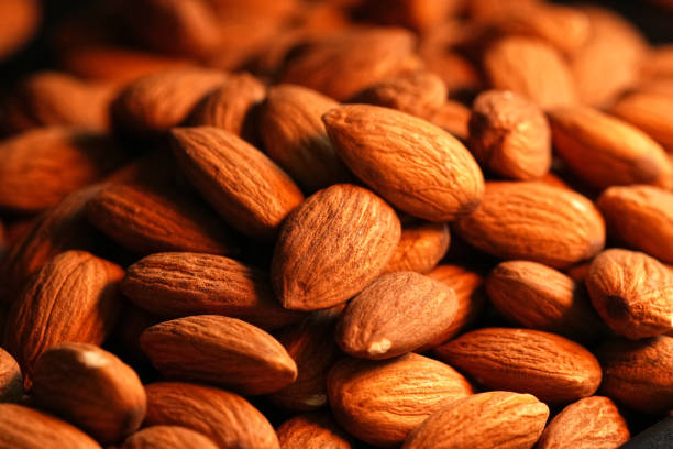 istock Close up Almonds in the Oven. 2157209625