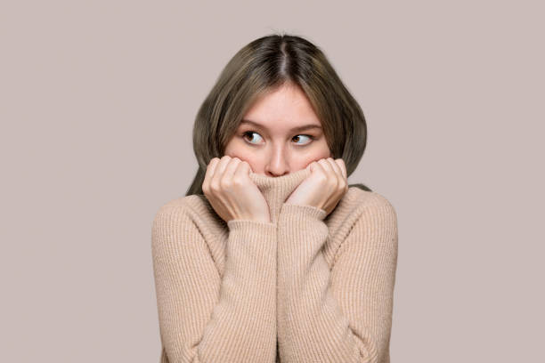 istock Woman in a beige sweater 2157211695