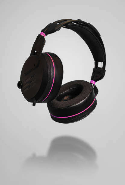 istock Black headphones isolated on gray background 2157212565
