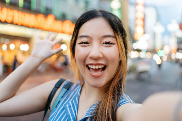 istock Smiling Asian woman taking self portrait 2157215550