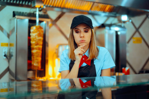 istock Fast Food Worker Looking at Ingredients Forgetting Recipe 2157215726