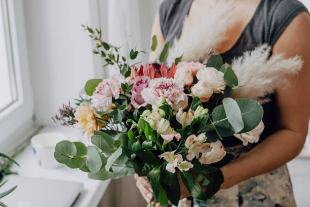 istock Woman holding a flower bouquet 2157216566