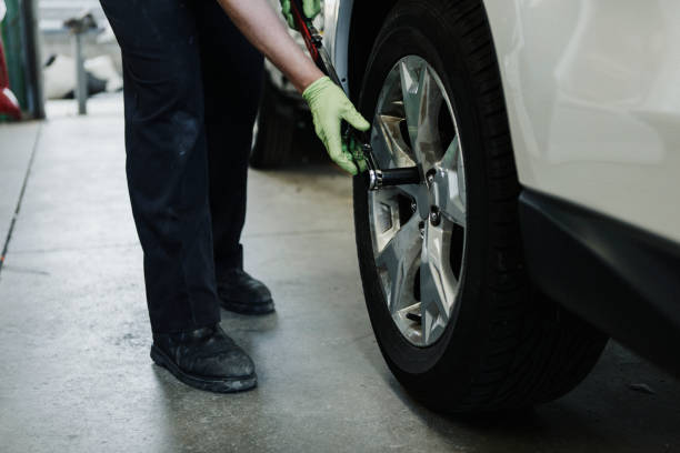 istock Mechanic fixing the car tires 2157216671