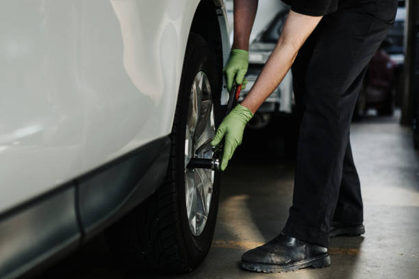 istock Mechanic fixing the car tires 2157216674