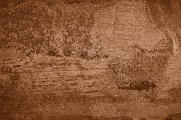 istock brown colored low contrast Concrete textured background with roughness and irregularities 2157217060
