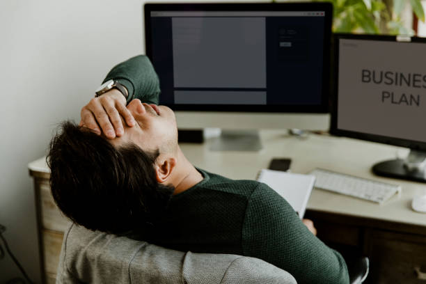 istock Stressful man working at home 2157217446