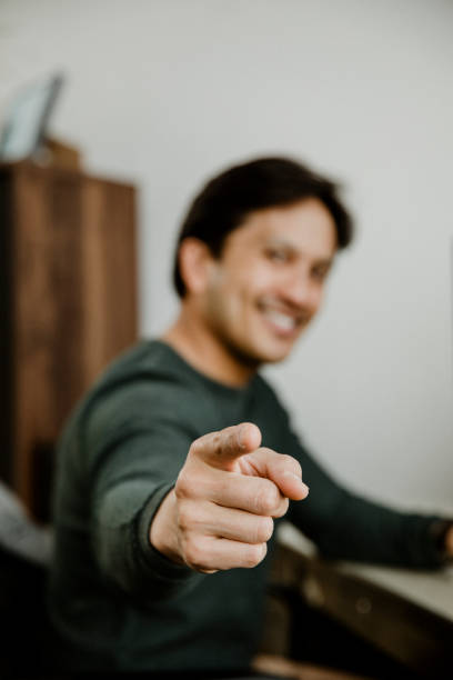 istock Happy man pointing at the screen 2157217599