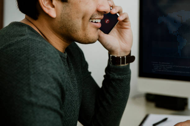 istock Happy man talking on the phone 2157217678
