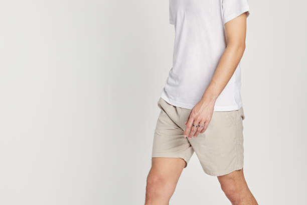 istock Man in white tee beige shorts mockup 2157217799