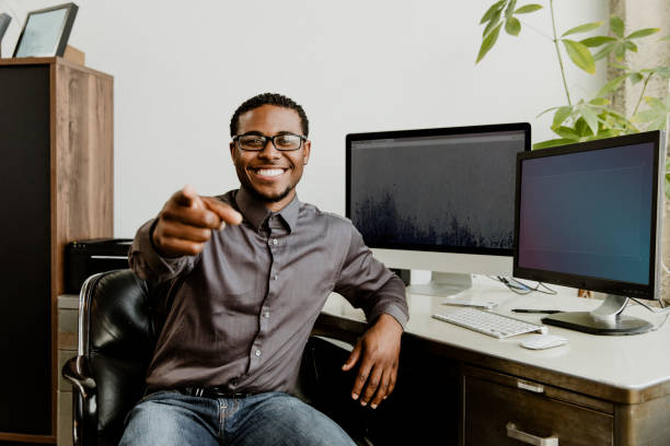 istock Happy black businessman pointing at the screen 2157217947