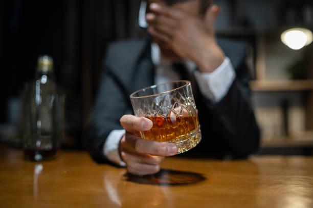 istock Barman pouring whiskey whiskey glass beautiful night 2157218329
