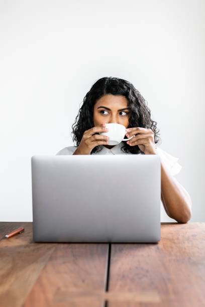 istock Black businesswoman drinking coffee 2157218440