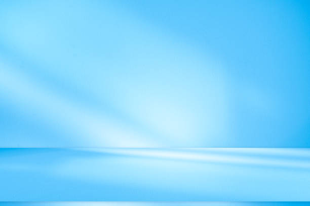 istock Wall interior background, studio, and backdrops show products. with shadow from window color white and blue light. background for text insertion and presentation of product 2157221003