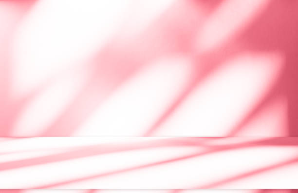 istock Wall interior background, studio, and backdrops show products. with shadow from window color white and pink light. background for text insertion and presentation of product 2157221005