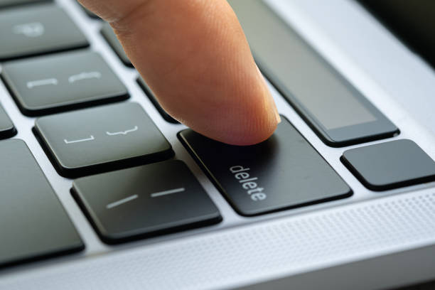 istock Finger of the computer user, he presses the delete button on the computer keyboard. 2157221120