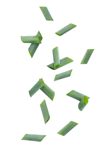 istock Falling cut fresh green onion. fresh green onion slices isolated on white background with clipping path 2157224652