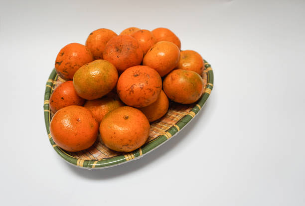 pile of oranges on a shaped plate