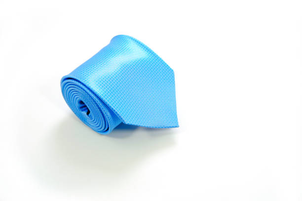 Groom holding his blue bow tie