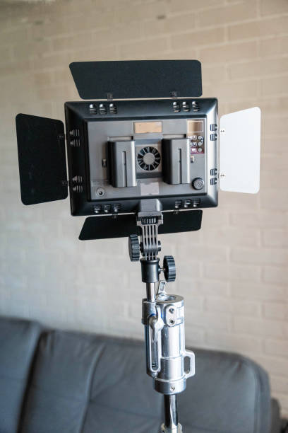 istock Rear view of a video lighting panel mounted on a tripod. LED flashlight,batteries 2157228307