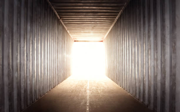 istock Empty Shipping Cargo Container. Light Shines from Outside. Square Room Space Opening. Abstract Background. 2157230109