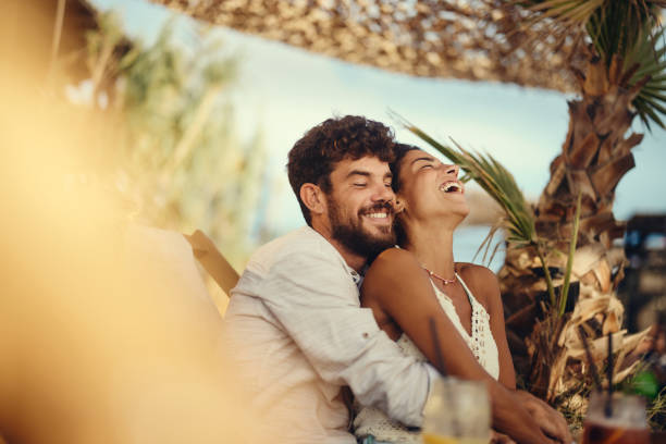 istock Young cheerful couple embracing in summer day. 2157230337