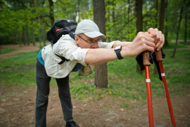 istock Senior man hiking in a forest in springtime or summer 2157230393
