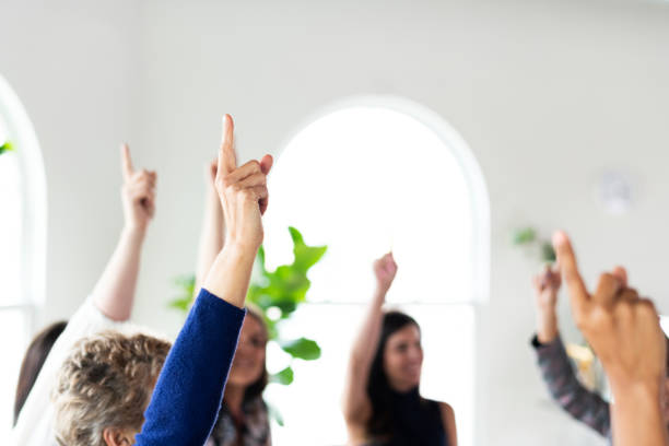 istock Hands making number one sign raised in the air 2157230402