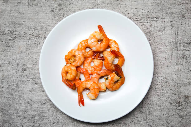 istock a plate of stir-fried prawns in a dish, as an entree. 2157231850
