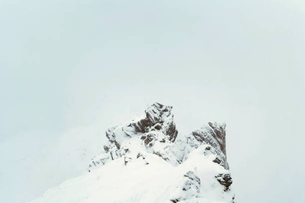 istock Snowy mountain top on a misty day 2157233405
