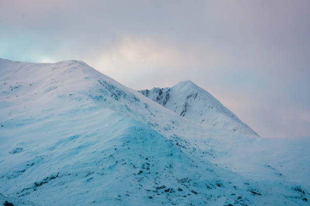 Snowy mountain top on a cloudy day