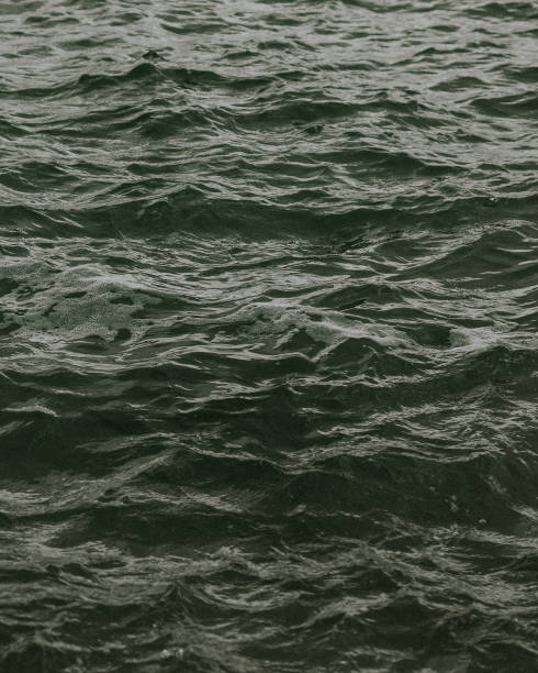 istock Gray calm waves of the ocean 2157233593