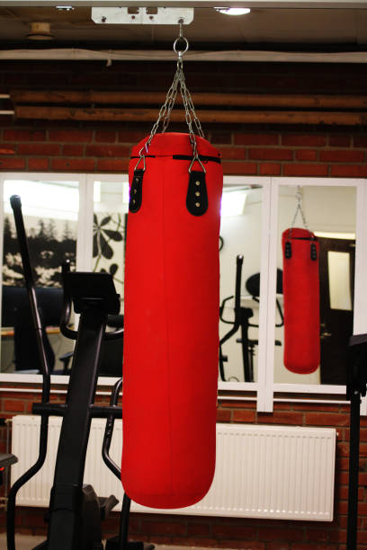 istock A red boxing bag hanging in a gym 2157234503