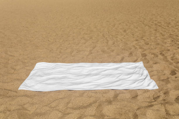 istock White beach towel on the sand 2157235137