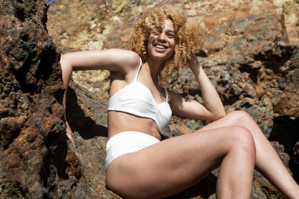 istock Confident woman in bikini posing outdoor shoot 2157235196
