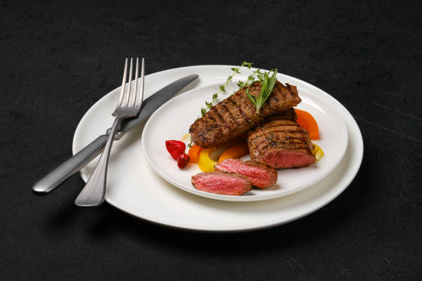 istock Grilled steaks cut on slices on a plate 2157235550