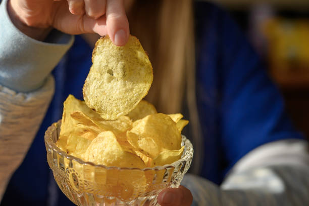 istock Fried crispy salted homemade potato chips 2157238223