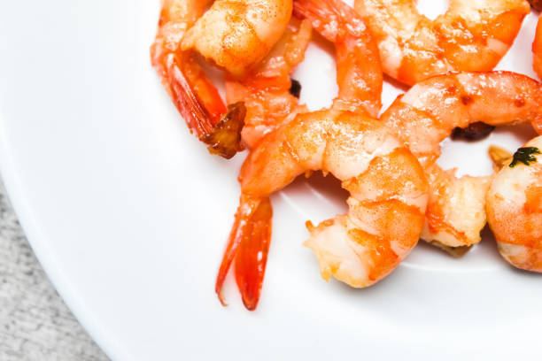 istock close up of cooked shrimp on a plate 2157239254