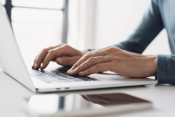 istock Man using laptop at home,, businessman working in office 2157243350