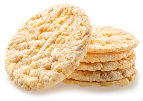 istock Puffed corn cakes or rice cakes isolated on white. Alternative snack for bread product 2157243447