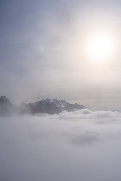 istock View of Swiss Alps over clouds on a sunny day 2157246302